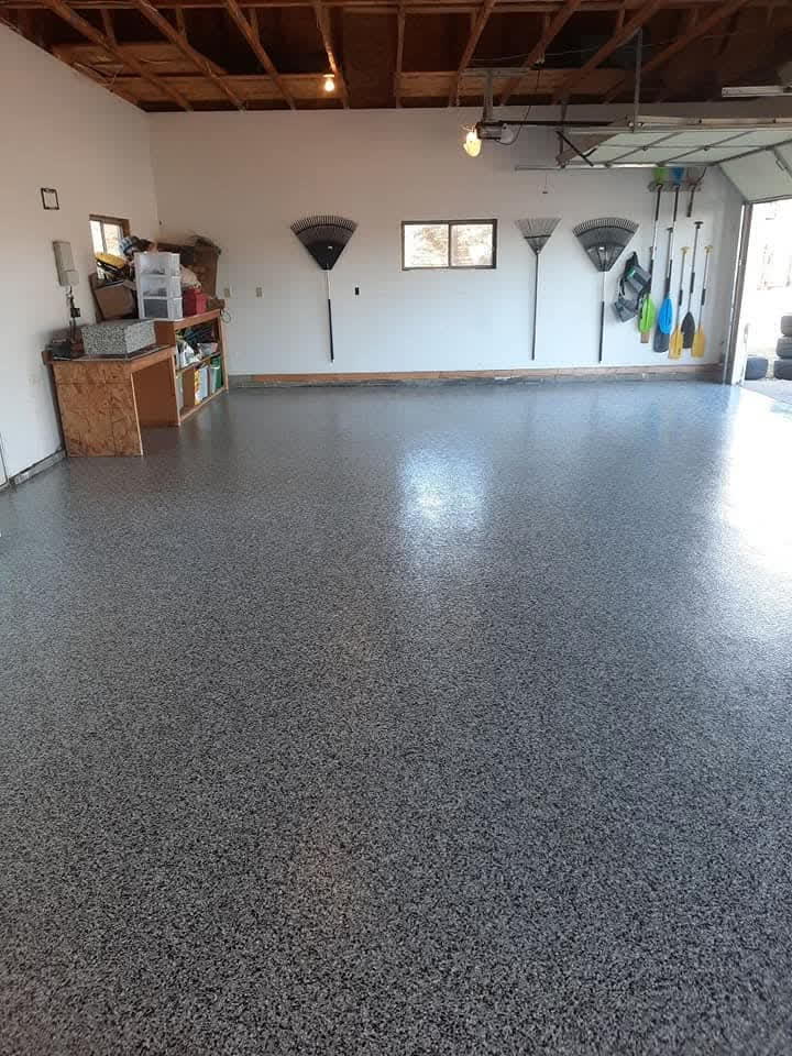 Resurfaced floor with polyurea coating and flake blend