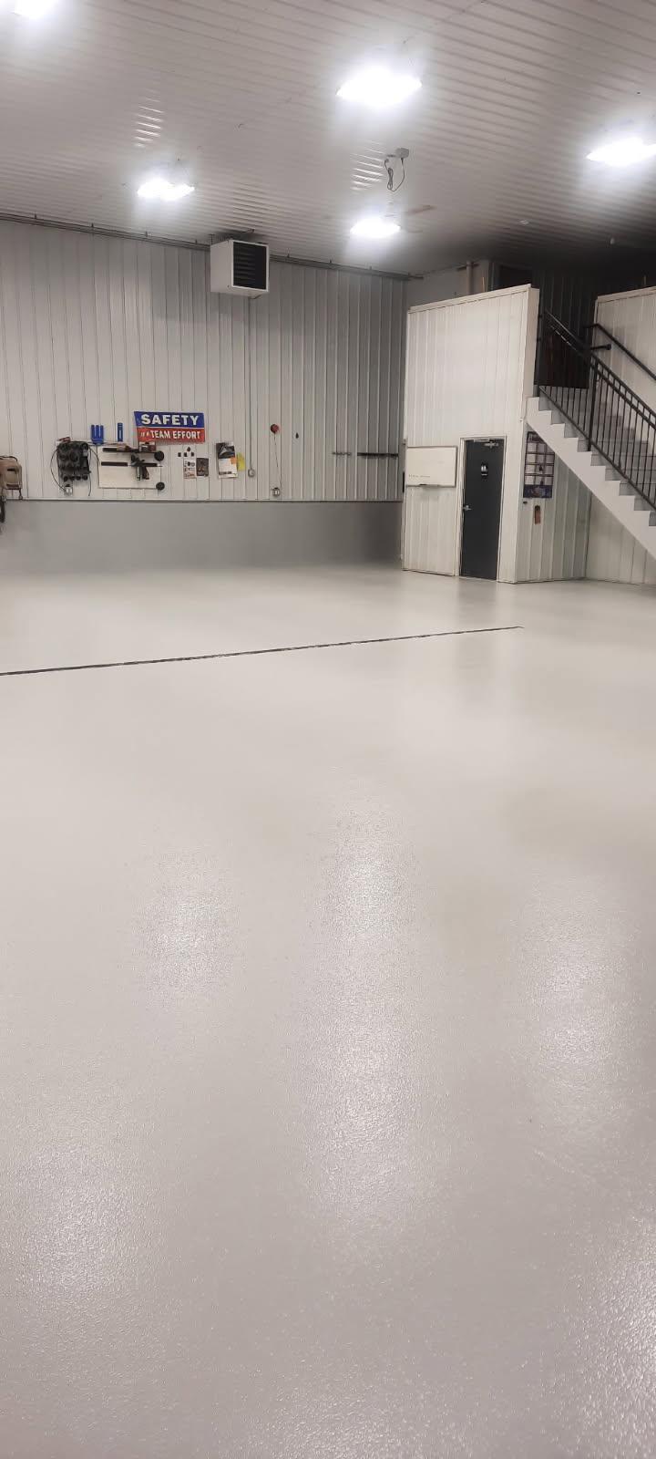 Large commercial shop floor — solid polyaspartic top coat for maximum slip resistance and easy chemical cleanup.